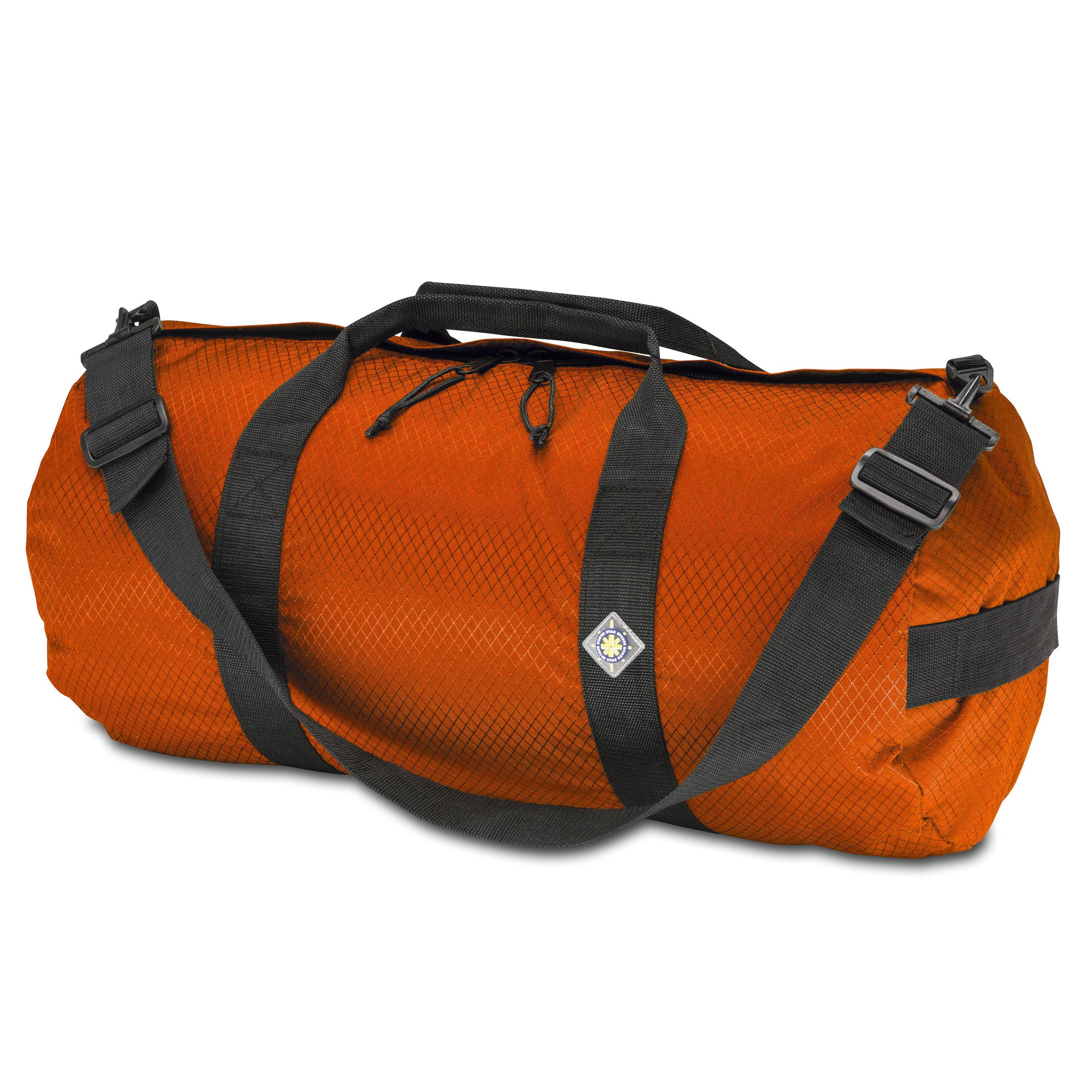 Studio photo the International Orange SD1224DLX Standard Duffle by Northstar Bags. 44 liter duffel with diamond ripstop fabric, thick webbing straps, and a large format metal zipper. Guaranteed for life.