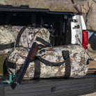 Lifestyle photo of King's Camo Desert Shadow print SD1224DLX Standard Duffle by Northstar Bags. 44 liter duffel with diamond ripstop fabric, thick webbing straps, and a large format metal zipper. Guaranteed for life.