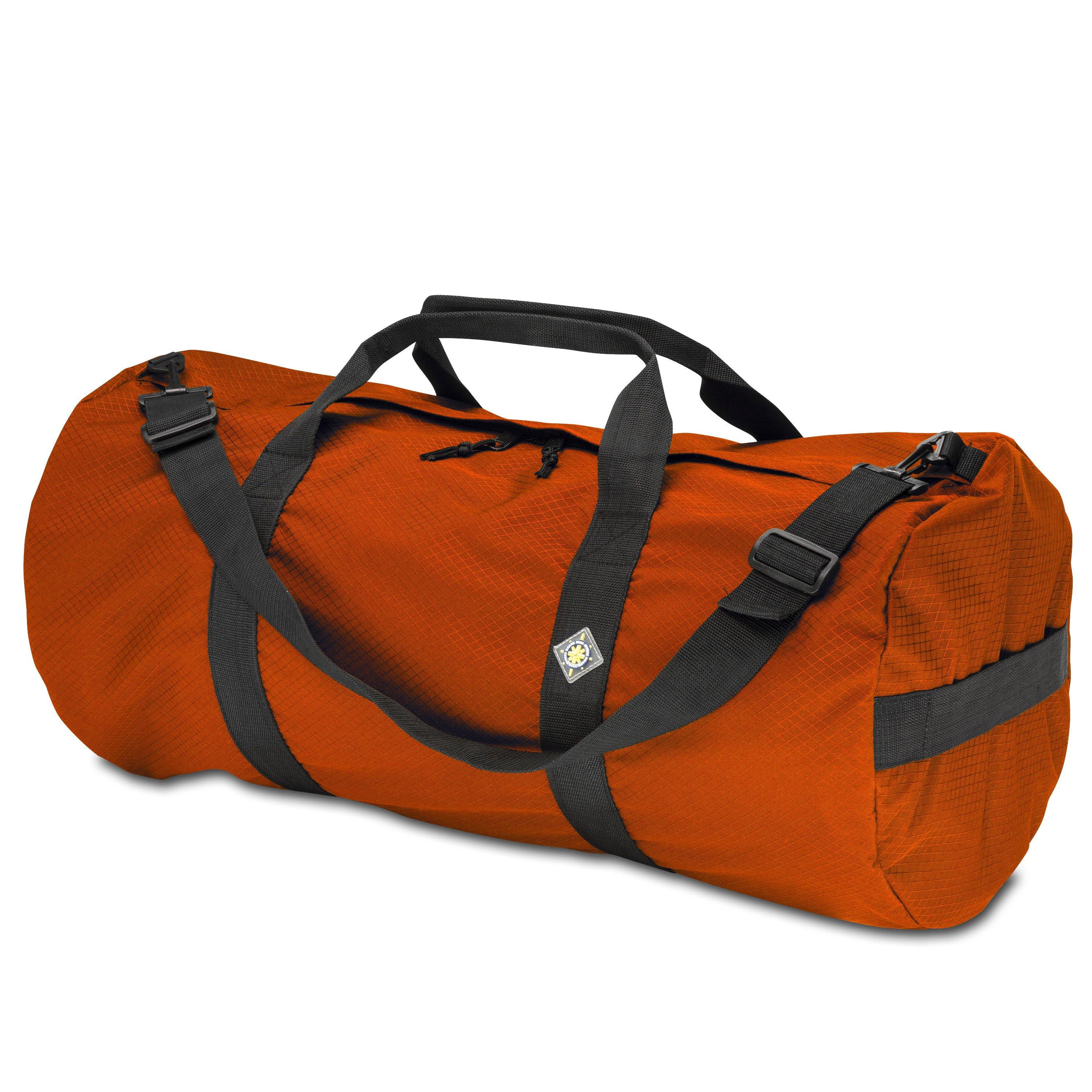 Studio photo the International Orange SD1430DLX Standard Duffle by Northstar Bags. 75 liter duffel with diamond ripstop fabric, thick webbing straps, and a large format metal zipper. Guaranteed for life.